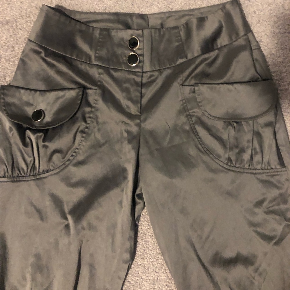 Gray capris with satin finish.